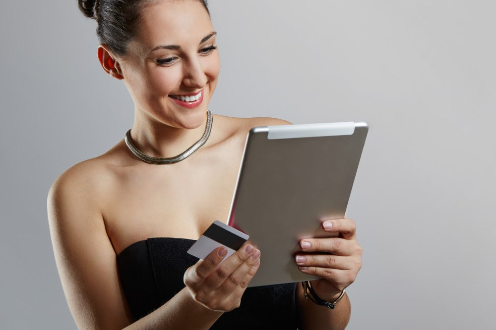 Woman shopping online wearing a luxury necklace